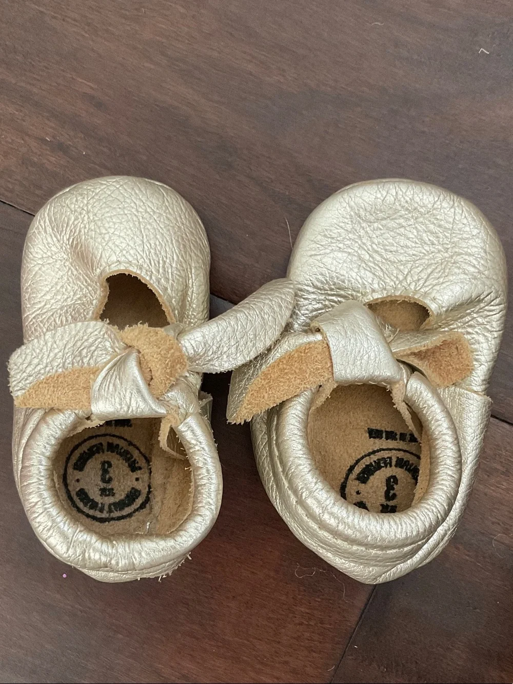 Freshly Picked Metallic Gold Bow Moccasins